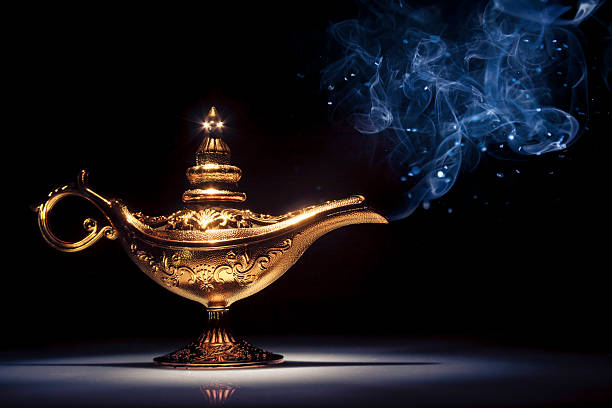 istock Genie's lamp under a spotlight with smoke coming out 462434573