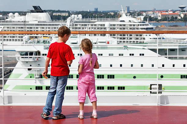 istock Boy and his sister stand with bread for seagulls 462436445