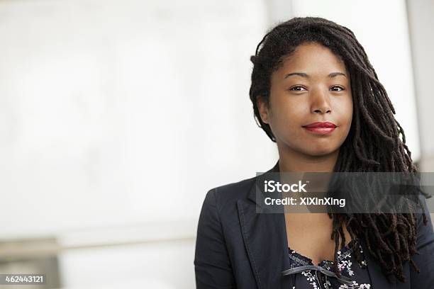 Portrait Of Smiling Businesswoman With Dreadlocks Head And Shoulders Stock Photo - Download Image Now