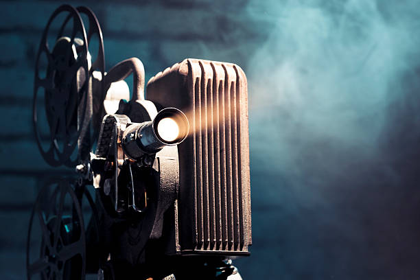 Photo of an old movie projector Old film projector with dramatic lighting vintage movie projector stock pictures, royalty-free photos & images