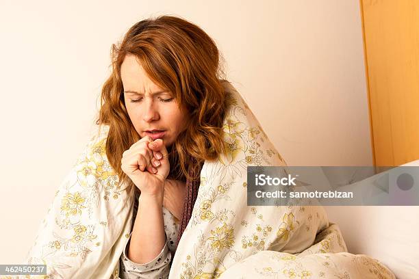 Sick Woman Cough In Bed Under Blanket Stock Photo - Download Image Now - Coughing, Bed - Furniture, Females