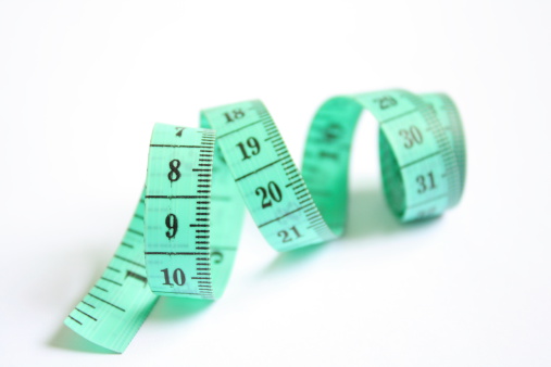 Tape measure on white background