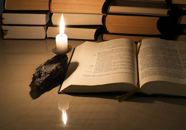 istock Gospel New Testament, candle and other books 462453981