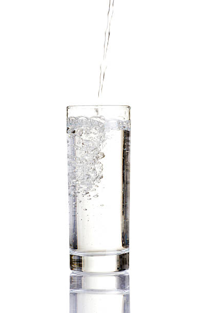 istock Pouring water on a glass 462461277
