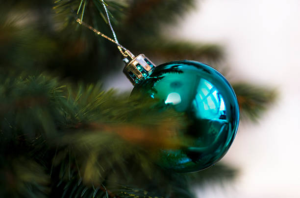 istock Blue glossy ball like Christmas ornament on Pine tree 462462221