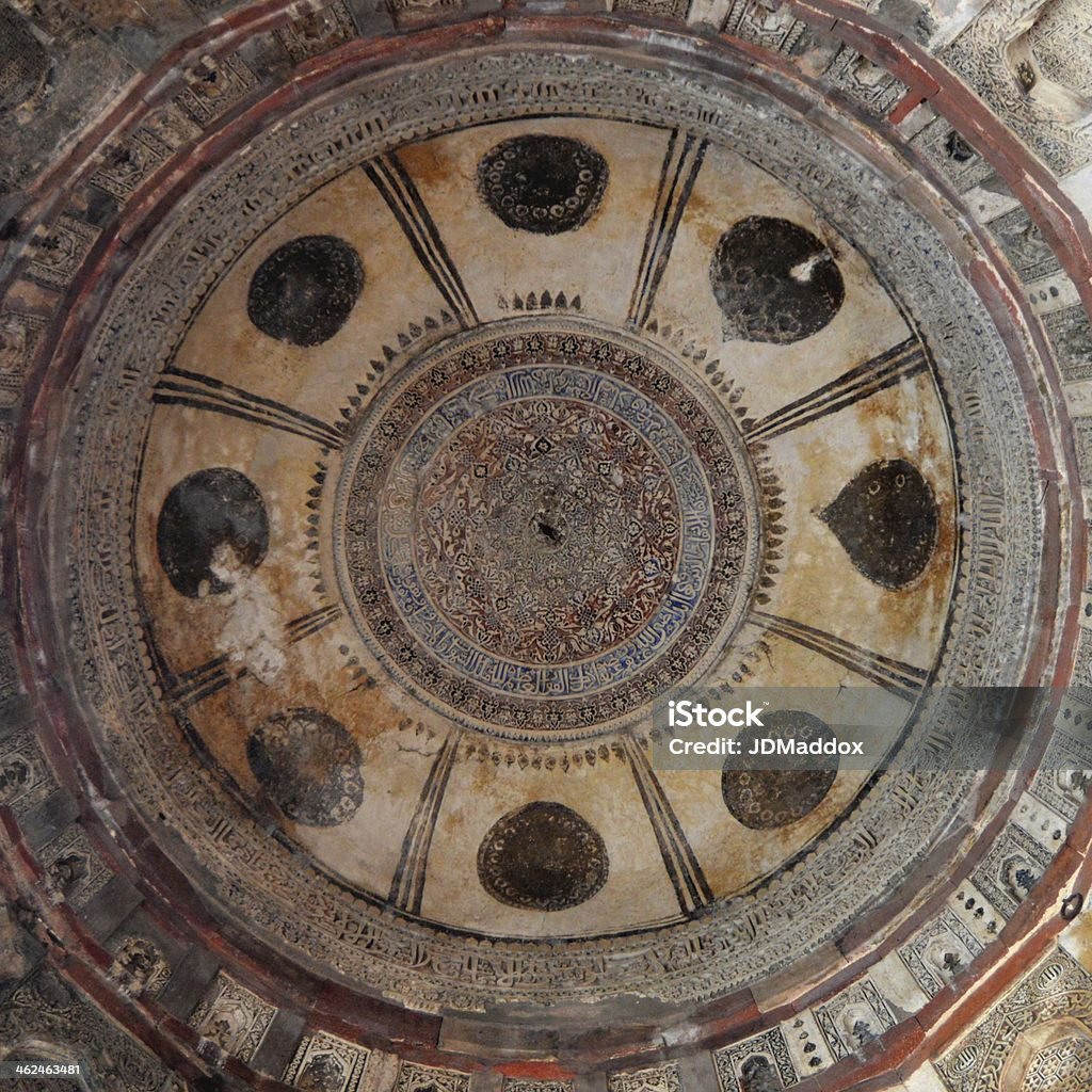 Colorfu mosque dome ceiling New Delhi, India - December 29, 2013: A domed ceiling in the Bara Gumbad mosque in Lodi Garden, New Delhi, with calligraphic Koranic verses carved into the stone Architectural Dome Stock Photo