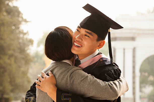 istock Mother and Graduate Hug 462464959