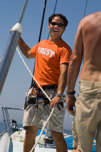 Sailors Working Ropes During Yacht Race