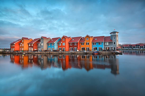 istock colorful buildings on water  at sunrise 462470157