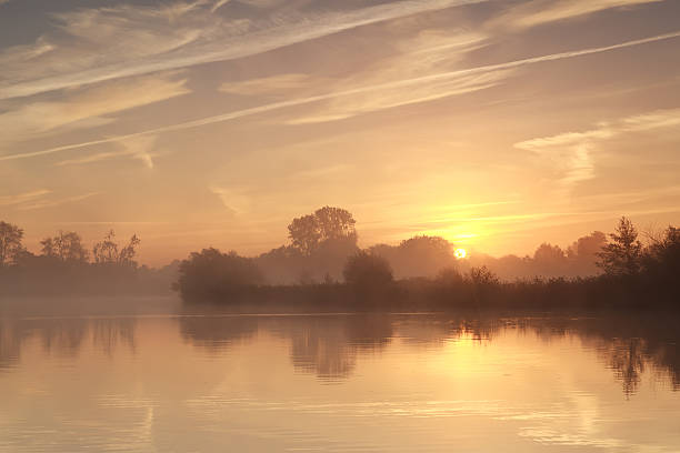 istock beautiful sunrise over wild lake 462470173