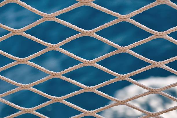 istock Knitted grid on boat banister 462471413