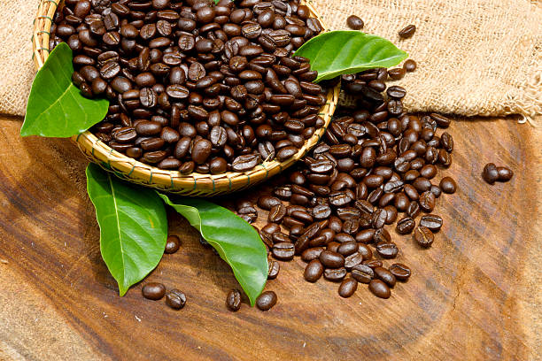 istock Coffee beans on the wooden background. 462475247