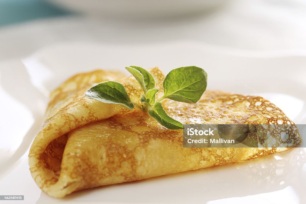 Pancake with oregano Pancake with sour cream on the plate Baked Stock Photo