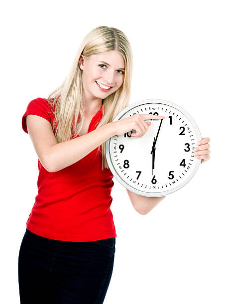 istock young woman with a clock isolated on white 462493169