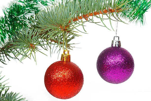 istock Two colored balls and green tinsel on the Christmas tree 462493479