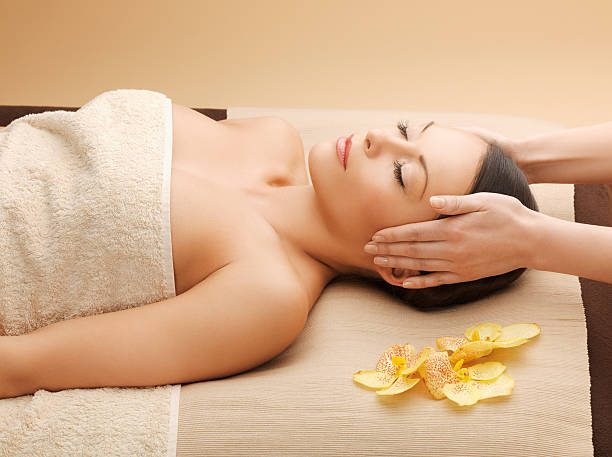 istock woman in spa salon lying on the massage desk 462494773