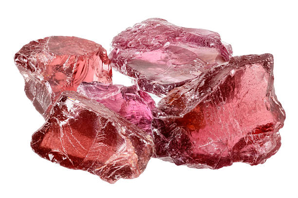 Rhodolite garnet crystals A pile of purple red rhodolite garnet gemstone crystals uncut, rough. Isolated on white garnet stock pictures, royalty-free photos & images
