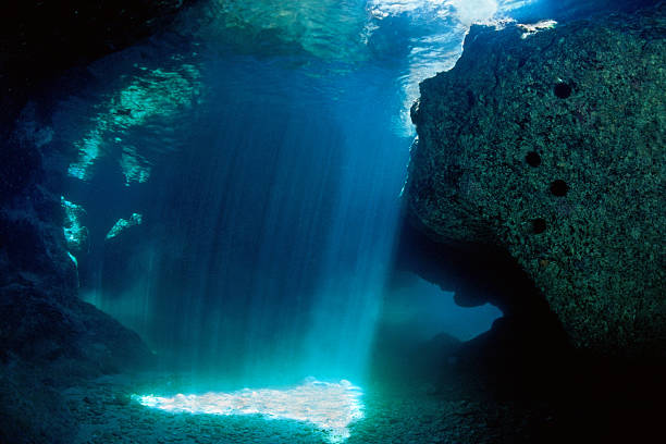 istock Shadow of a grotto subacquea with blue lighting 462497051