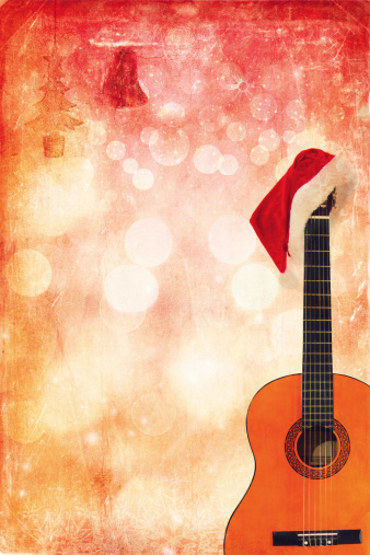 Christmas cap with Classic Guitar on grunge background