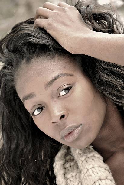 istock young woman with hand in hair 462503677