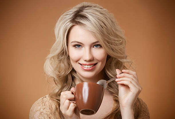 istock Stylish woman with an aromatic coffee in hands 462504357