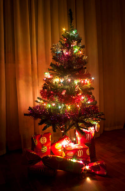 istock decorated Christmas tree with gift boxes at Russian home 462507013