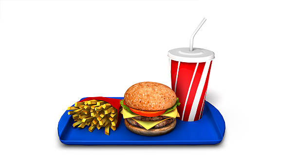 Burger, fries and soft drink atop blue tray stock photo