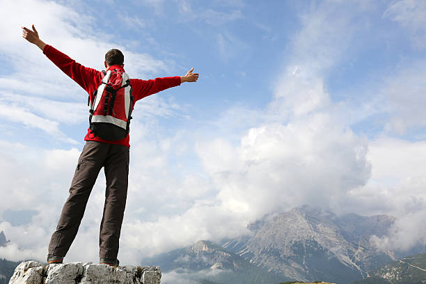 istock Mountaineer on top of a mountain 462512221