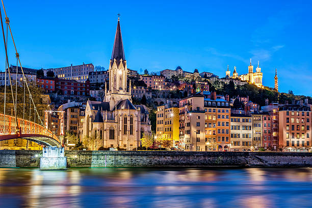 Nighttime cityscape of Lyon, France from the Saone River Famous view of Lyon with Saone river at night lyon photos stock pictures, royalty-free photos & images