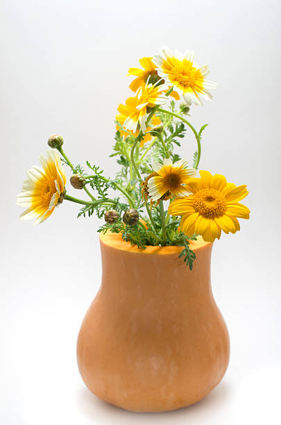 istock Pumkin bucket wth wildflowers 462520815
