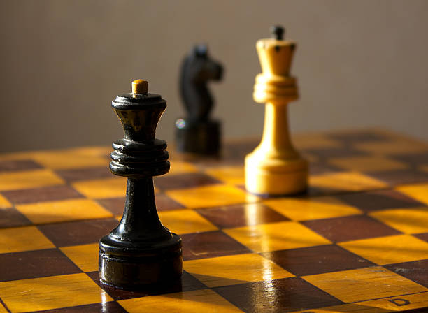 istock black queen and white king on the chessboard 462529093