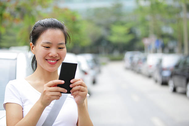 istock asian woman use smart phone 462530049