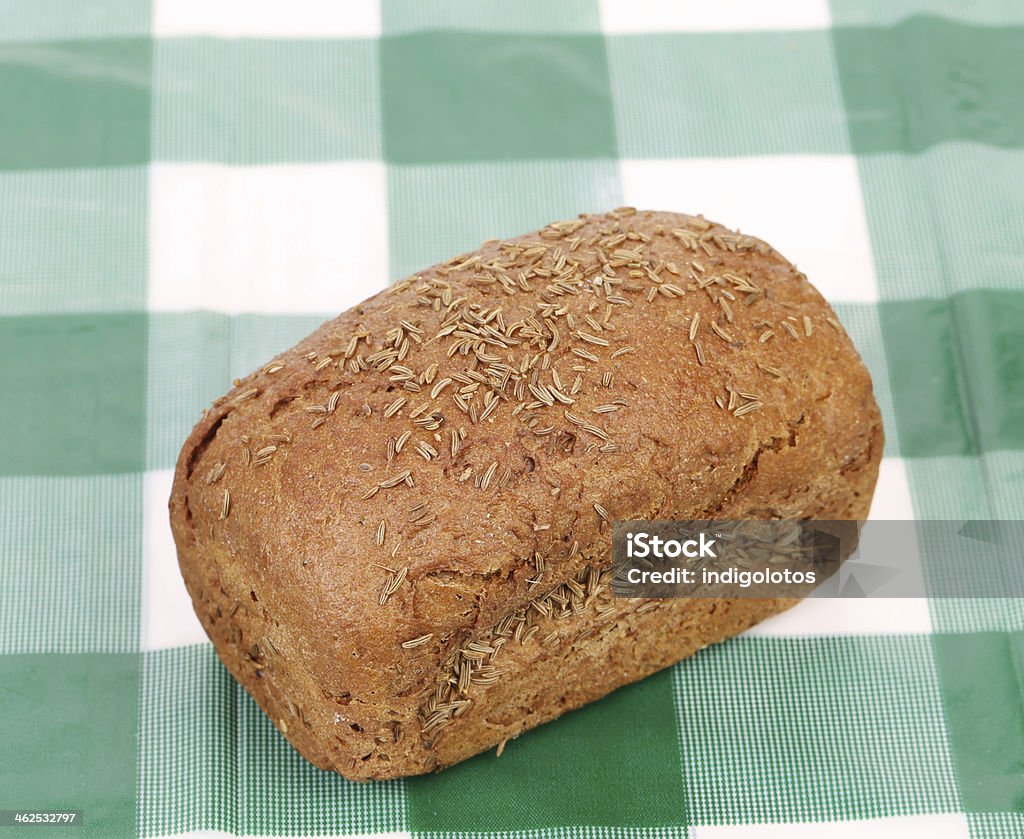 Rye bread with caraway seed. Rye bread with caraway seed. Isolated on a tablecloth. Baked Pastry Item Stock Photo
