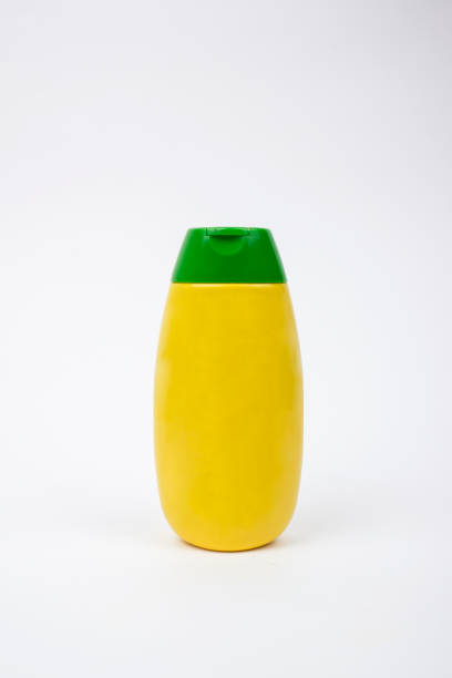 горчица бутылка - yellow mustard mustard indoors vertical стоковые фото и изображения