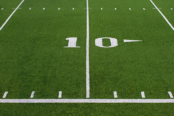 Football Field Football field stadium 10 yard line. offensive line stock pictures, royalty-free photos & images