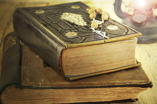 istock Christian cross necklace next to holy Bible. 462541741