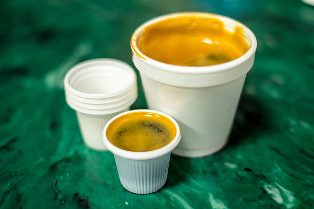 Cuban Espresso Cuban coffee in a Styrofoam cup with small plastic dispensing cups. cuban ethnicity stock pictures, royalty-free photos & images