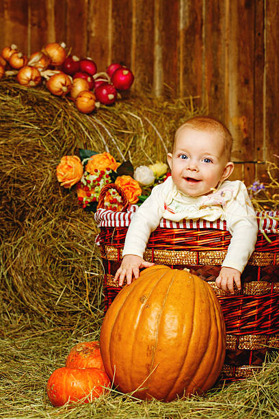 istock Girl and halloween pumpkins 462547495