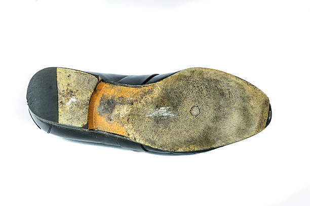 istock worn sole of shoes isolated on white background 462556785