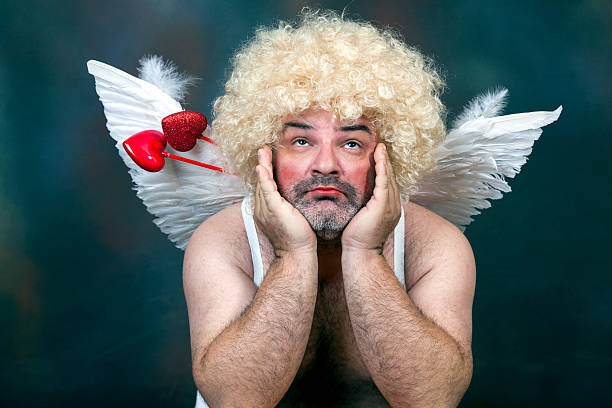 Mature Cupid Fat bearded mature hairy cupid with heart arrow. hairy fat man pictures stock pictures, royalty-free photos & images