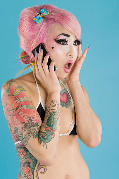 istock Young woman talking on cell phone over blue background 462563553