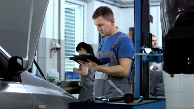 Mechanic Using A Digital Tablet