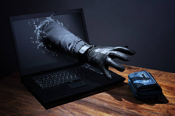 Internet crime and electronic banking security Stealing a purse through a laptop concept for computer hacker, network security and electronic banking security data breach photos stock pictures, royalty-free photos & images