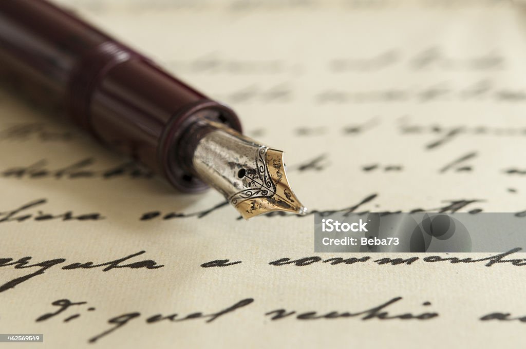 old fountain pen on manuscript an old fountain pen on a manuscript Poetry - Literature Stock Photo