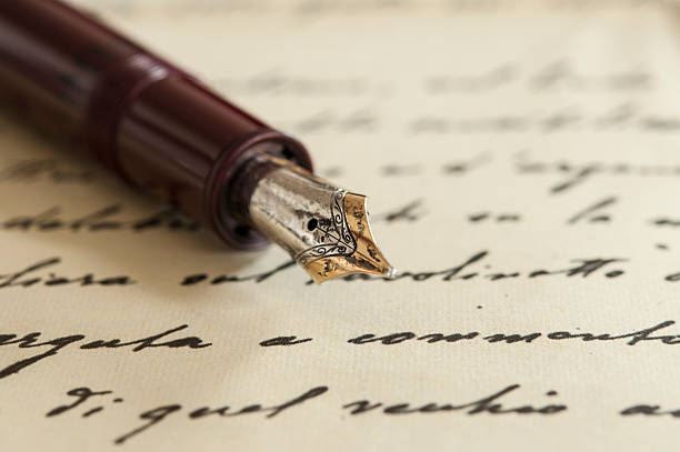 old fountain pen on manuscript an old fountain pen on a manuscript poetry stock pictures, royalty-free photos & images