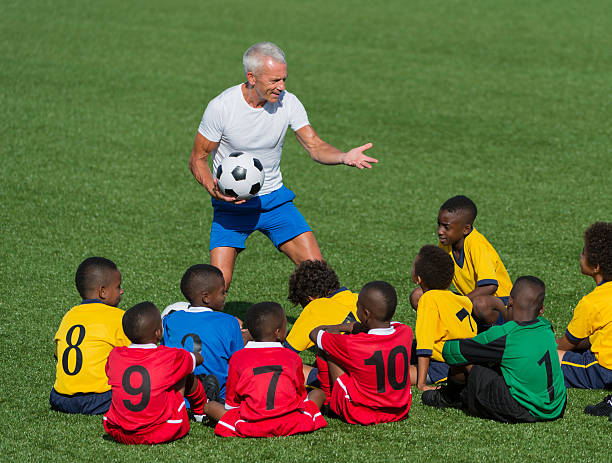 istock Kids Soccer Team With Their Coach 462576663