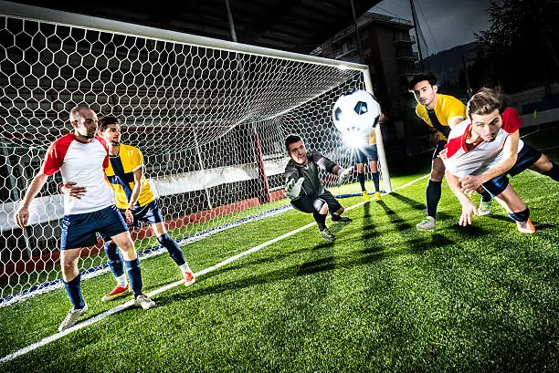 Photo of Football match in stadium: Header goal