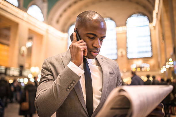 istock business man reading a newspaper inside the station 462576911