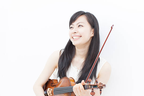 istock girl with violin 462577293
