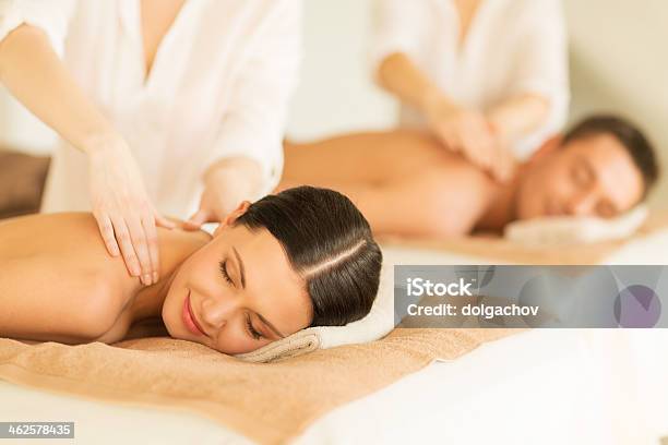 Happy Couple In Spa Salon Having Massage Stock Photo - Download Image Now - Couple - Relationship, Alternative Therapy, Back